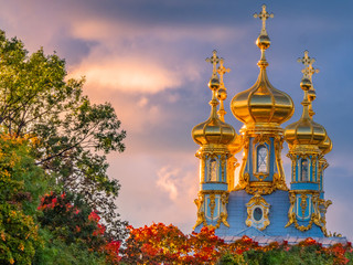 Pushkin. Russia. Catherine palace. The Catherine Palace domes are illuminated by the sunset sun....