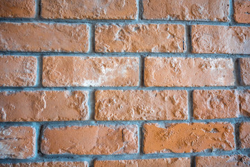 Closeup clean orange brick and cement wall for background, copy space, wallpaper