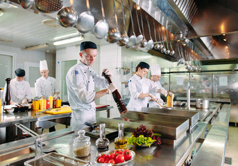 Modern kitchen. The chefs prepare meals in the restaurant's kitchen.