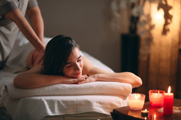 Obraz na płótnie Canvas Spa, massage. Young dark-haired beautiful girl doing massage.