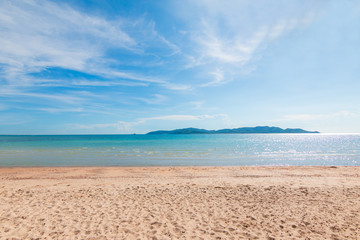 Fototapeta na wymiar Scenic of summer sand beach and cloudy blue sky