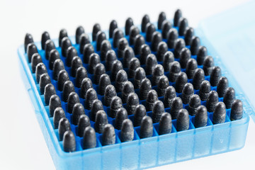 Hunting cartridges in a plastic box. Bullet storage box.