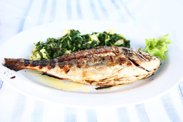  grilled fish with cooked vegetables