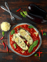 Grilled aubergine, eggplant topped with parmesan cheese crust on crashed tomatoes. Vegetarian pizza version