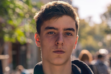portrait of a confident young man in the street