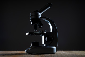 close up of a microscope in a dark room