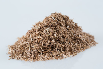 Pile of wood smoking chips isolated on white.