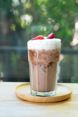 Chocolate drink with freeze strawberry and milk foam on top