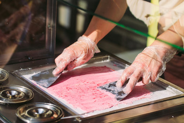 stir-fried ice cream rolls at freeze pan. Organic, natural rolled ice cream, hand made dessert.
