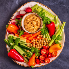 Hummus with various fresh raw vegetables.