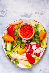 Plate with fresh, raw vegetables and sauce.