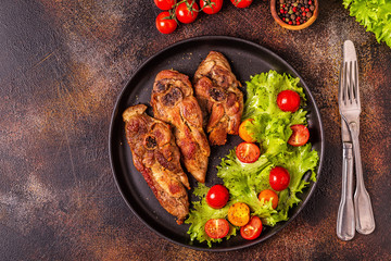 Roasted turkey steak with salad.