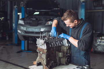 Master collects a rebuilt motor for the car..