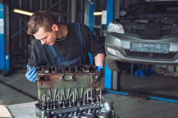 Master collects a rebuilt motor for the car..
