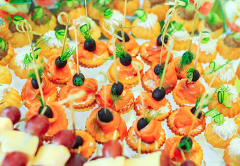 Background of party appetizers on wooden sticks