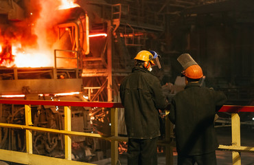 Workers in the steel mill.