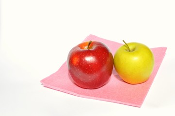 Apples on a pink napkin