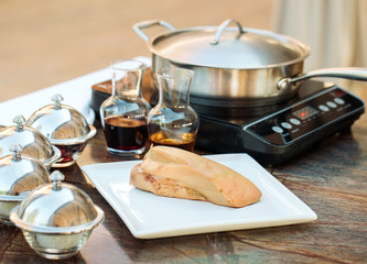 Goose liver on a wooden Board in the restaurant before cooking. © davit85