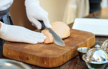 Goose liver on a wooden Board in the restaurant before cooking. © davit85