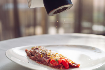 The Dish Is Carpaccio. Waiter Pepper dish.