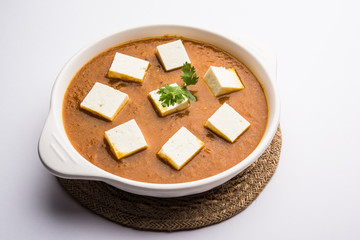 Paneer butter masala or Panir makhanwala, served in a bowl. selective focus