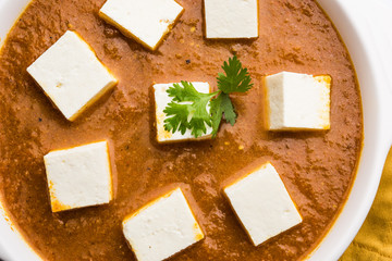 Paneer butter masala or Panir makhanwala, served in a bowl. selective focus