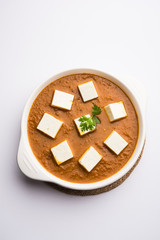 Paneer butter masala or Panir makhanwala, served in a bowl. selective focus
