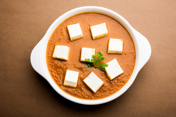 Paneer butter masala or Panir makhanwala, served in a bowl. selective focus