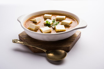 Paneer butter masala or Panir makhanwala, served in a bowl. selective focus