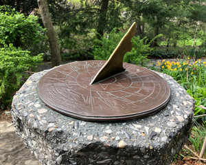 Sundial clock time outdoor in park settings, closeup