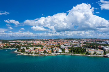 Fototapeta na wymiar Aerial view of city of Zadar. Summer time in Dalmatia region of Croatia. Coastline and turquoise water and blue sky with clouds. Photo made by drone from above.