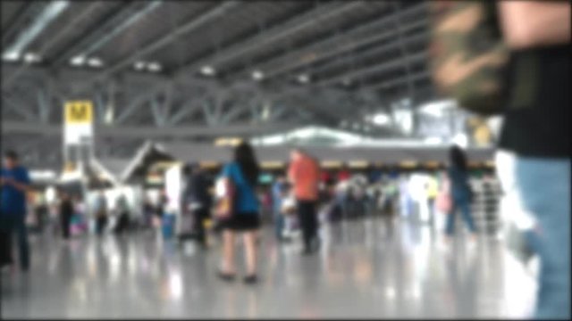 Time lapse blur background of tourist people in airport terminal building