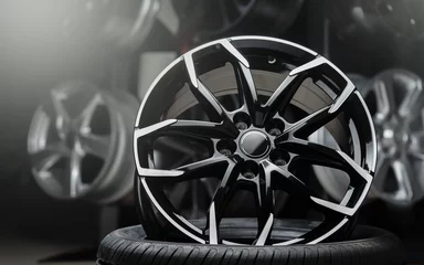 Fotobehang beautiful alloy wheels dark background, close up. © Vladimir Razgulyaev