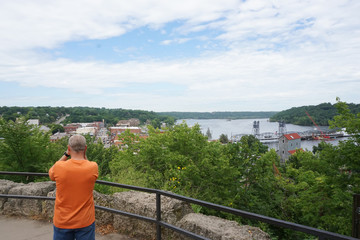Fototapeta premium A man standing on a overlook in Still Water, Minnesota.