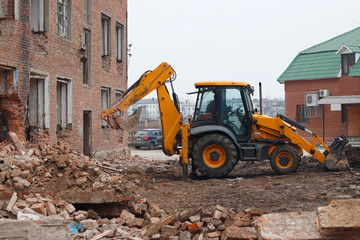 excavator bucket breaks the house