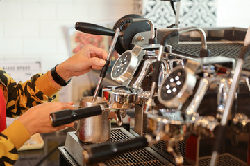 young muslim barista girl hands making coffee