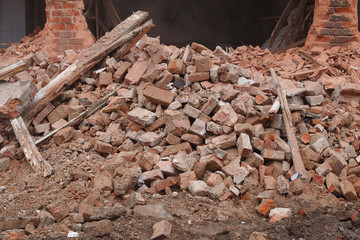 the ruins of collapsed houses, piles of brick construction waste