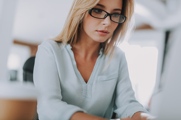 Close up of young woman looking concentrated