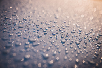 water drops on pearl white surface