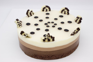 Chocolate cake. Cake of several varieties of chocolate: black, milk and white.