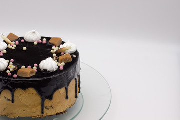 homemade chocolate cake with marshmallow, caramel, sugar