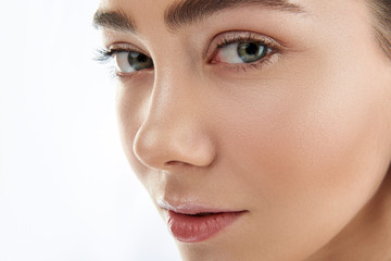 Fototapeta premium Portrait of pretty female with green eyes