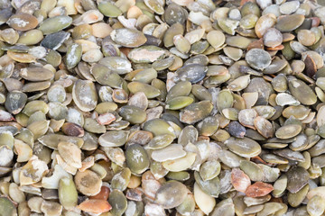 Lots of pumpkin seeds as background.