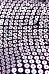 Fabric with sequins and sequins of bright colors. Fashion glitter fabric, sequins. Shiny surface