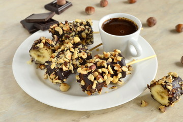 Frozen banana in chocolate and hazelnuts