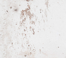 abstract brown splashes on white watercolor paper.