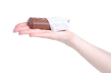 Chocolate bar in hand on a white background. Isolation
