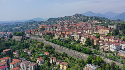 Fototapeta premium Aerial drone photo of iconic and beautiful old fortified upper Medieval city of Bergamo, Lombardy, Italy