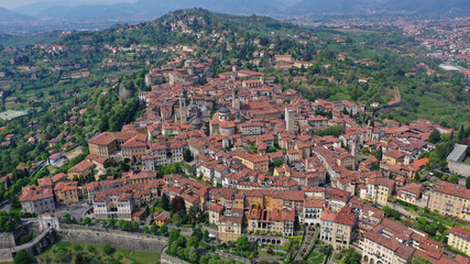 Obraz premium Aerial drone photo of iconic and beautiful old fortified upper Medieval city of Bergamo, Lombardy, Italy
