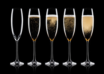 Elegant glasses of yellow champagne with bubbles